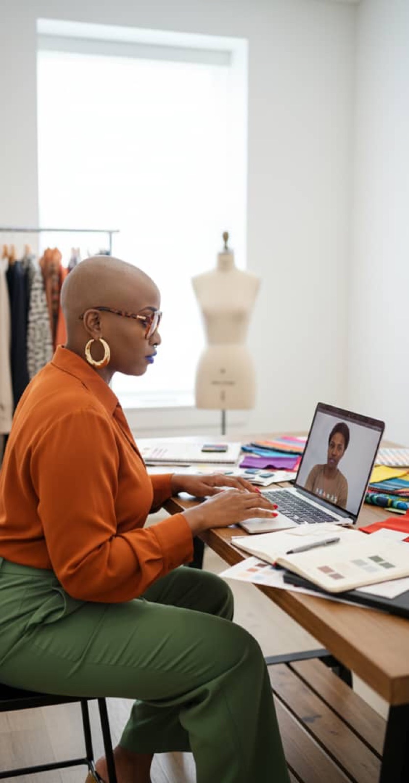 Virtual consultation desk with color swatches, notebook, and laptop