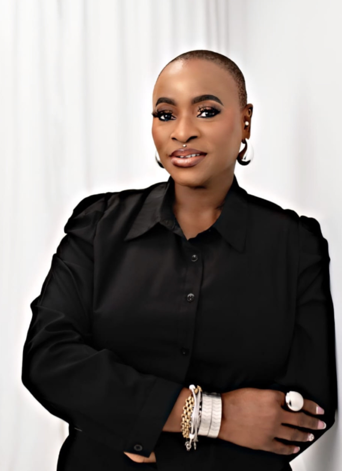 Funke Roberts in black, arms crossed